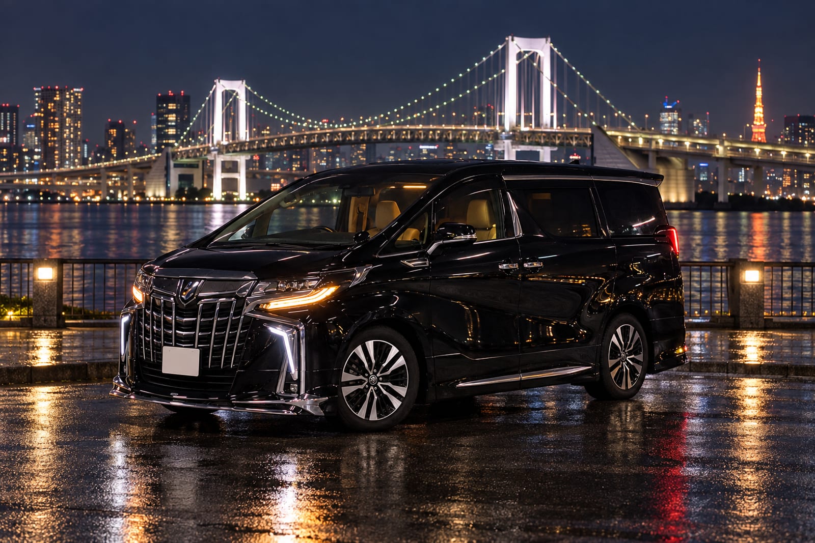 夜のお台場、レインボーブリッジを背に停まる送迎車